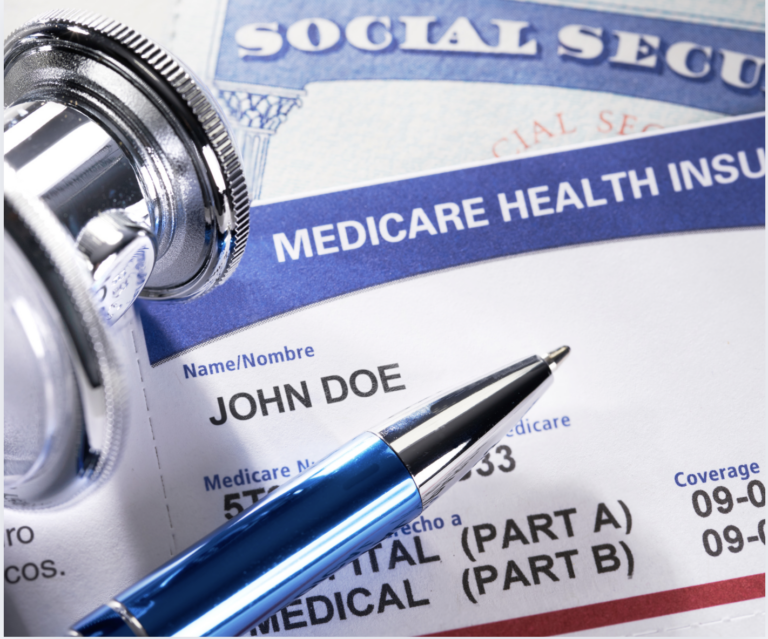a medicare health insurance card and a stethoscope sit on top of a social security card
